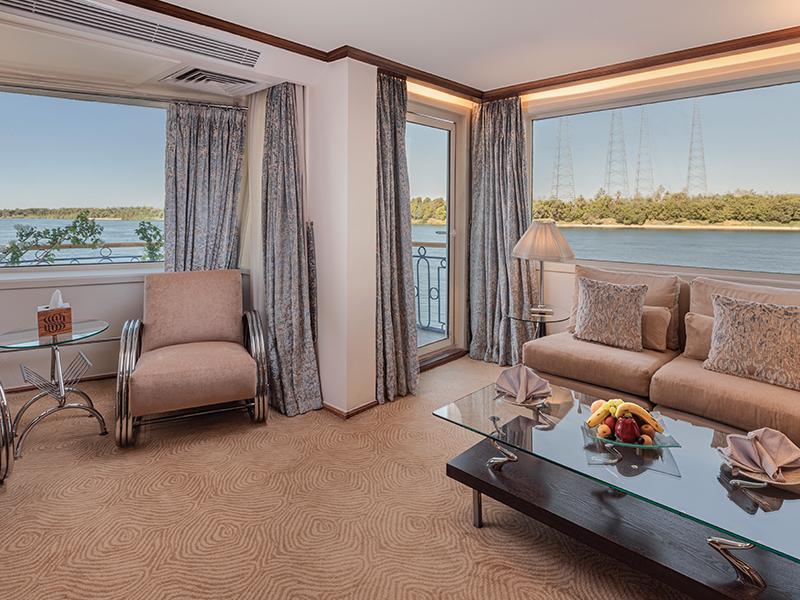A seating area in a room on the Sonesta Star Goddess Cruise.